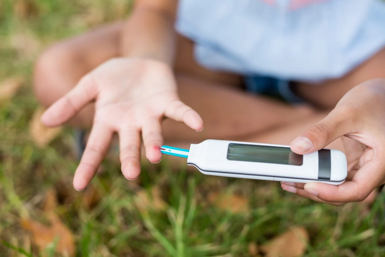 girl testing diabetes on glucose meter VUDJY7H scaled opt - What Does CBD Do? [The Best And Ultimate Guide To CBD In 2024]