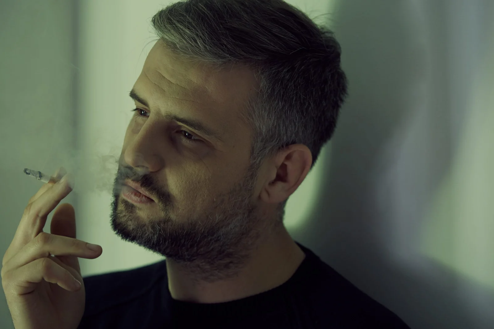 man smoking cigarette PN2QHFF scaled opt - What Does CBD Do? [The Best And Ultimate Guide To CBD In 2024]