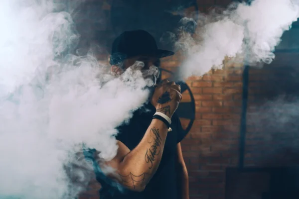man vaping an electronic cigarette PMQYW83 scaled opt - Everything You Need To Know About Terpene E-Liquids